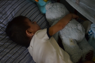 Cooper Sleeping with His Bear